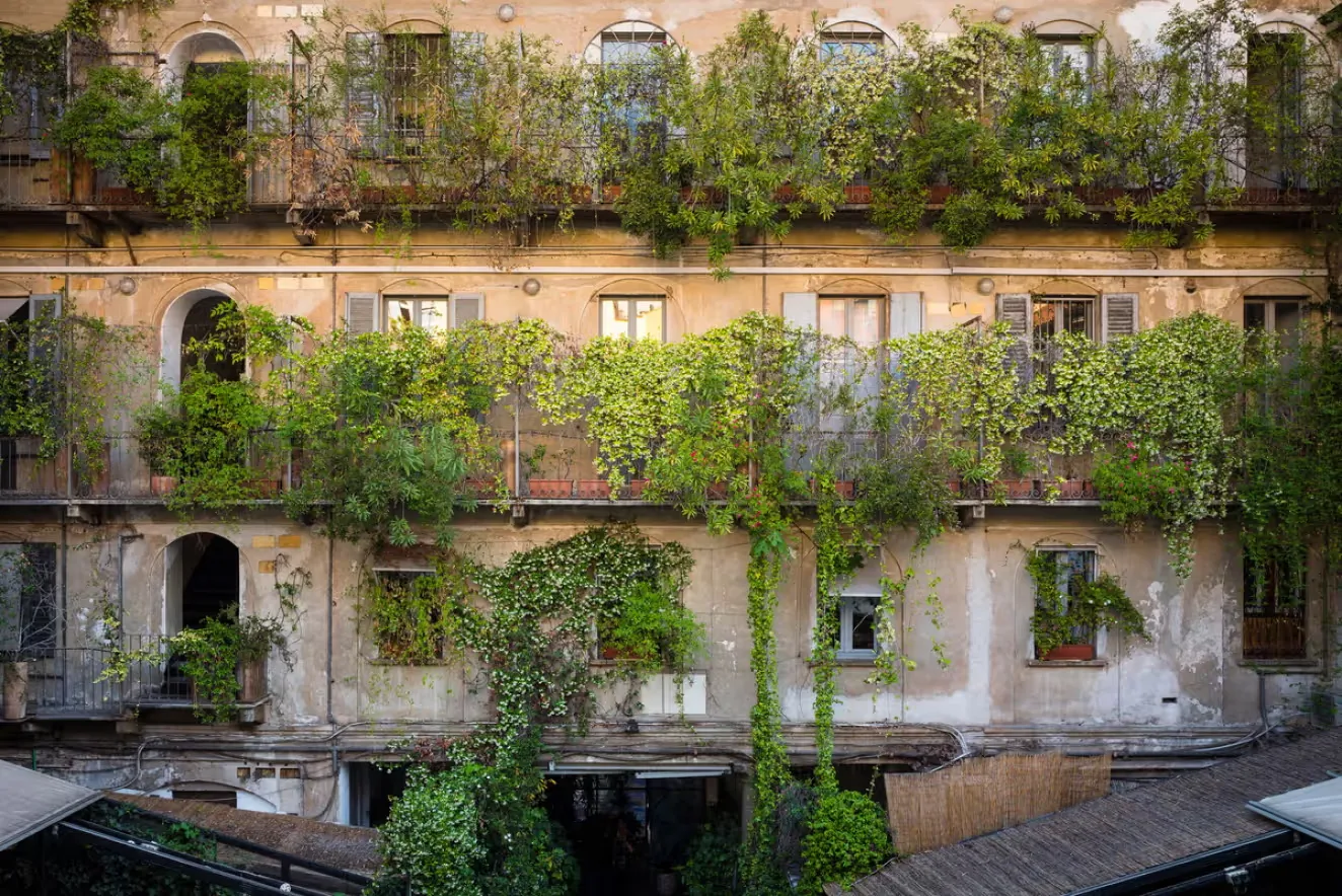 Residential courtyard with plants on the balconies in Italy